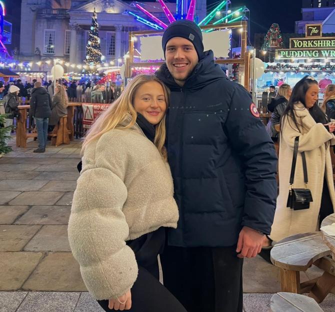 Daisy Campbell and her new boyfriend Nick posing at a night fair.