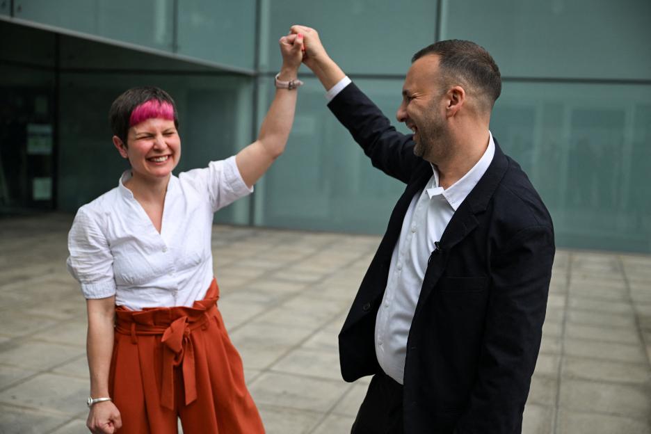 Britain's Green Party leader Zack Polanski and Hackney Mayor Zoe Garbett celebrate election results.