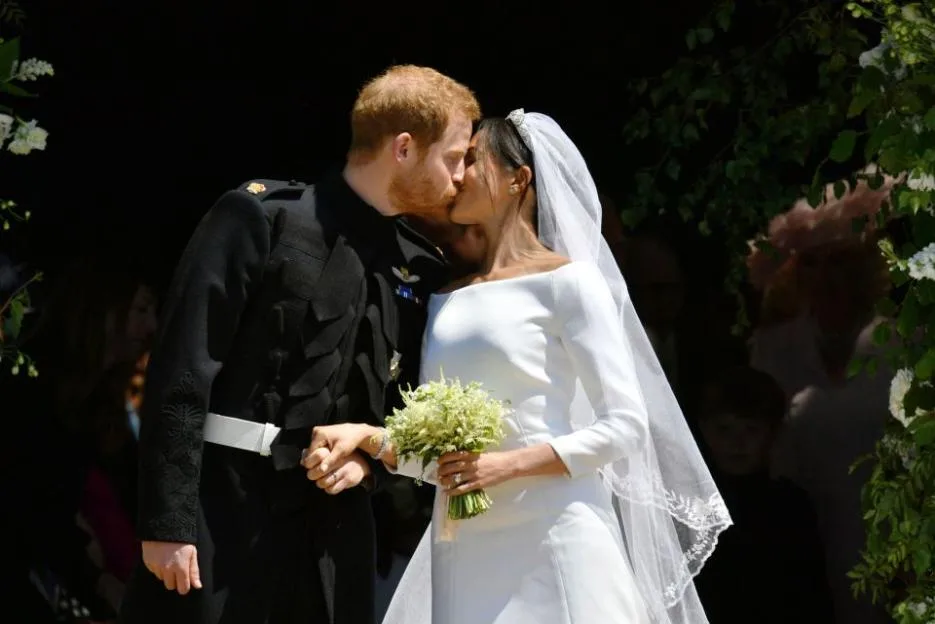 Prince Harry and Meghan Markle kiss after their wedding ceremony at St. George's Chapel in Windsor Castle.