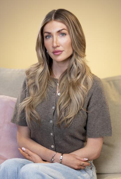 Kate Cassidy, Liam Payne's girlfriend, sitting and looking forward.