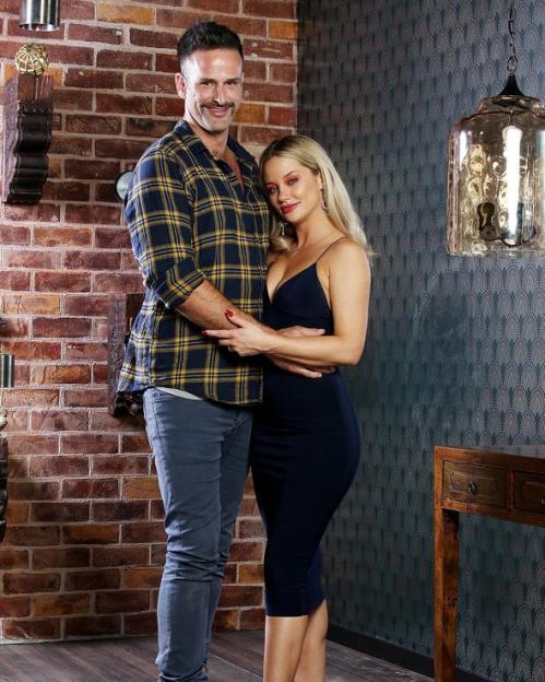 Jessika Power and Mick Gould embracing.