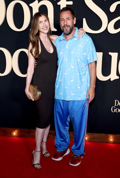 Jackie and Adam Sandler pose at the "Don't Say Good Luck" premiere.