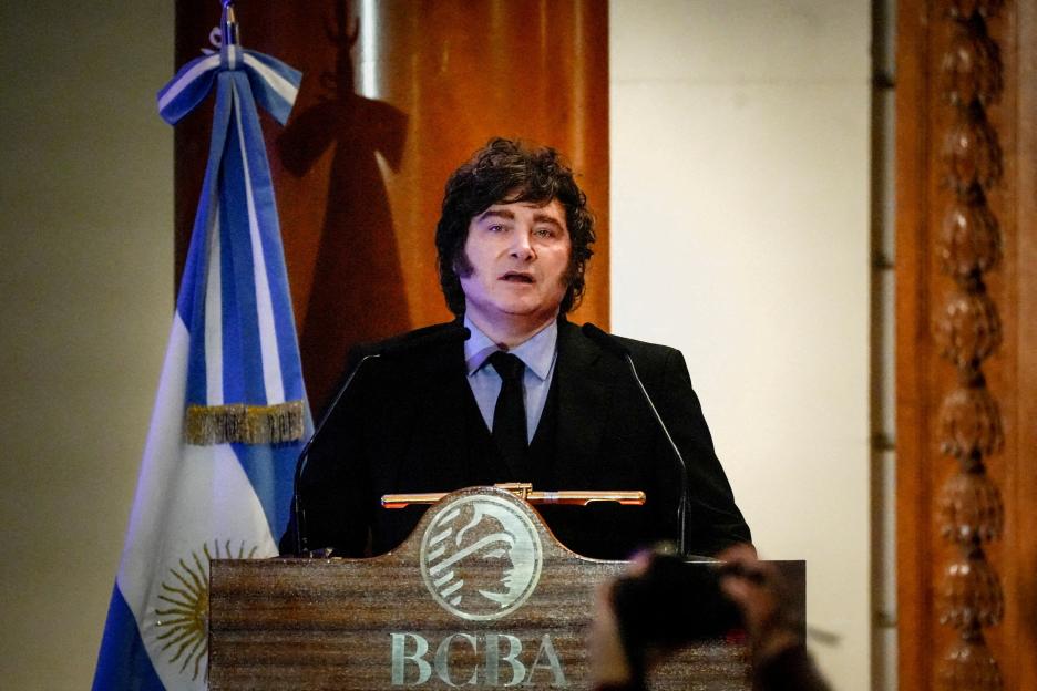 Argentine President Javier Milei waves during a ceremony commemorating the 172nd anniversary of the Buenos Aires Stock Exchange.