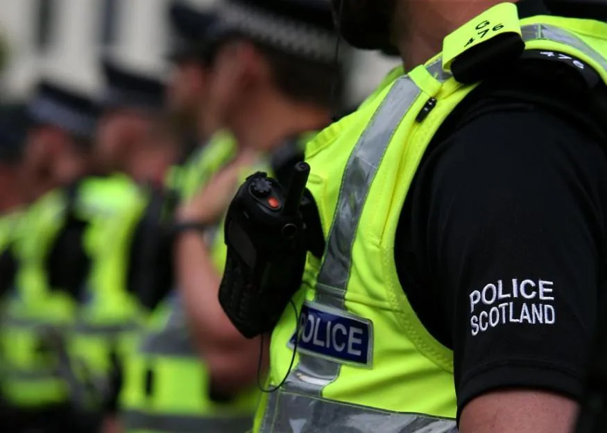 Police Scotland officers at a demonstration.