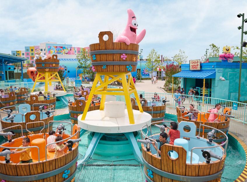 People riding a Spongebob Squarepants-themed water ride.