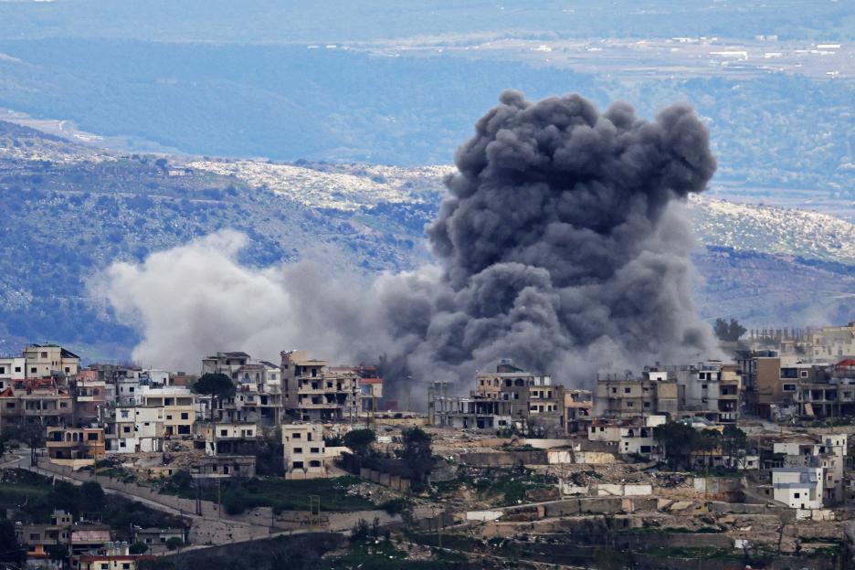 Smoke rises from an Israeli bombardment in the southern Lebanese village of Khiam.