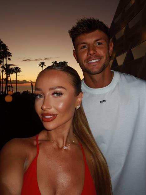 Nicole Samuel and Dylan posing for a loved-up photo at sunset.