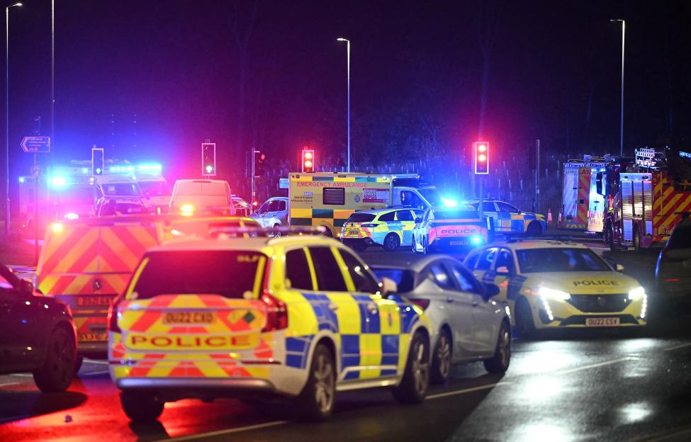 Police cars and ambulances gathered outside Huntingdon Station following a stabbing on a train.