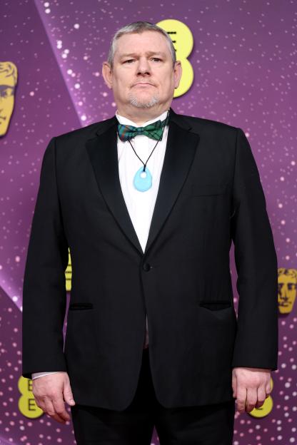 John Davidson attends the EE BAFTA Film Awards 2026.