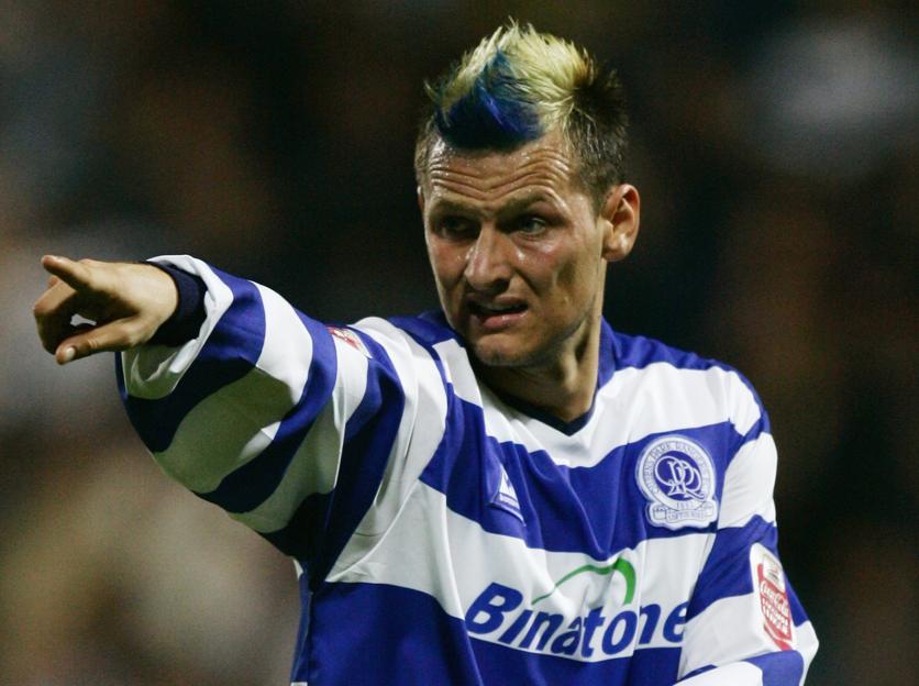 Marc Bircham in a Queens Park Rangers uniform pointing.