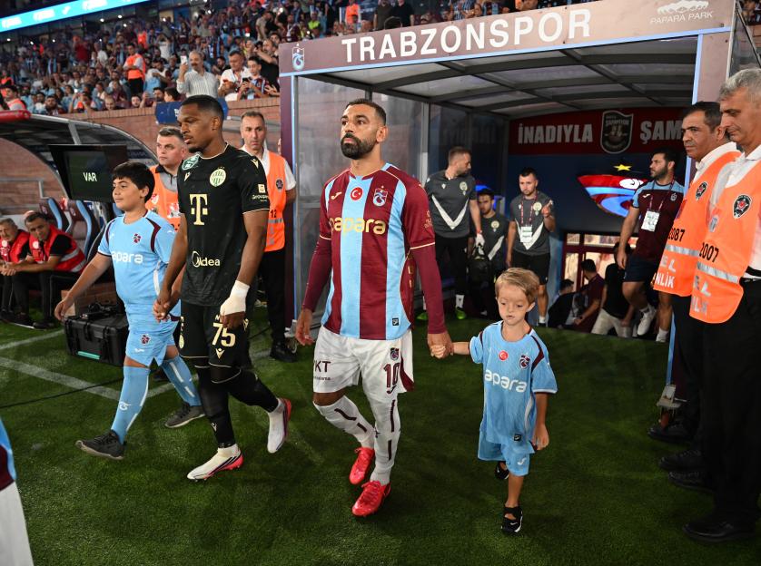 "Touching Moment: Mo Salah Takes the Field with His Biggest Fan, Isaac, for the Trabzonspor Showdown"