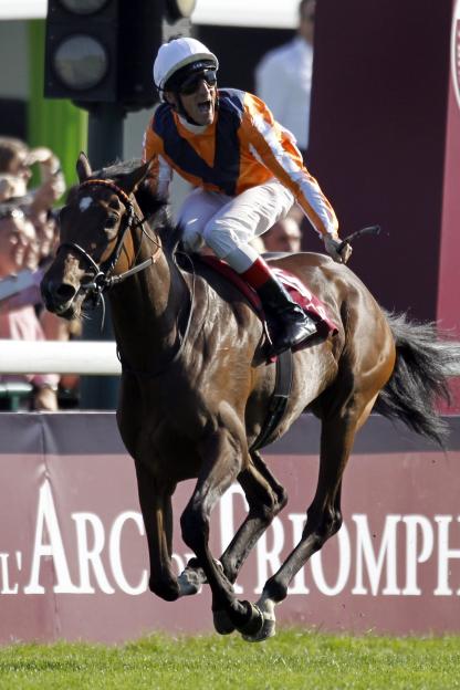 Germany's Starke on Danedream reacts after crossing the finish line to win the Qatar Prix de l'Arc de Triomphe at the Longchamp horse racetrack