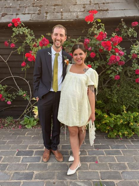 Lauren Layfield and her partner smiling at the camera.