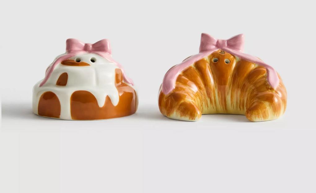 Two pastry-shaped salt and pepper shakers with pink bows.