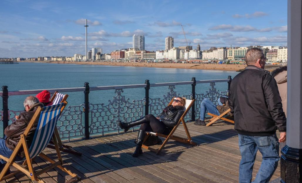 Brighton UK 14th February 2026 - Visitors enjoy a beautiful sunny but chilly day on Brighton Palace Pier after weeks of rain throughout Britain : Credit Simon Dack / Alamy Live News