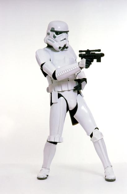 A Star Wars Stormtrooper in white armor holding a blaster.