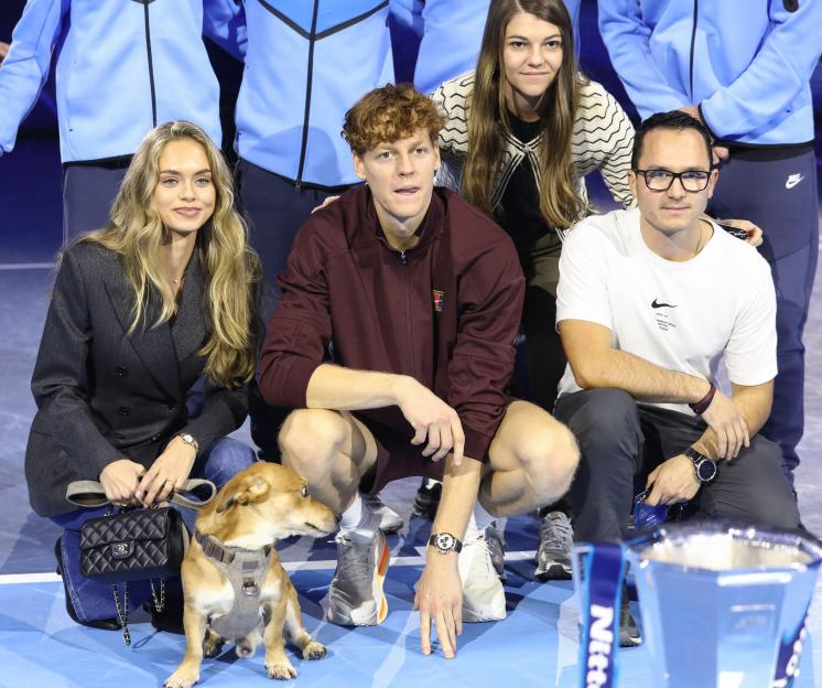 Laila Hasanovic, Jannik Sinner, and their dog Snoopy after the ATP Tennis Finals in Turin, Italy.
