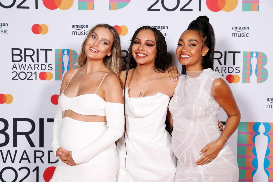 Perrie Edwards, Jade Thirlwall, and Leigh-Anne Pinnock of Little Mix posing on the red carpet at the BRIT Awards 2021.