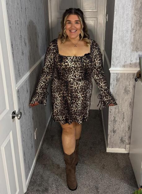 Becky Jones in a leopard print dress.