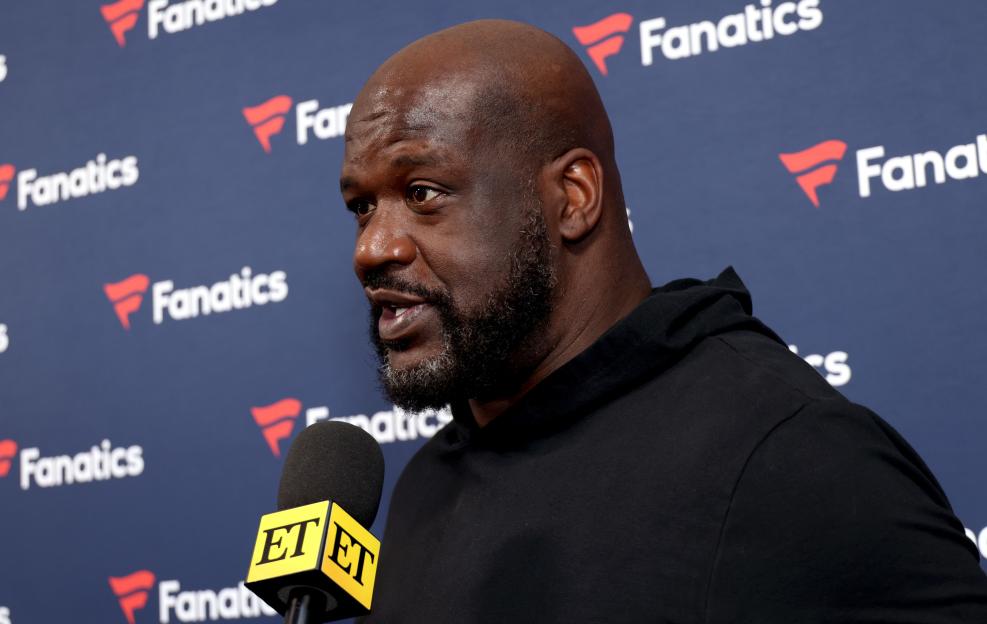 Shaquille O'Neal speaking into an ET microphone at the 2025 Fanatics Super Bowl Party.