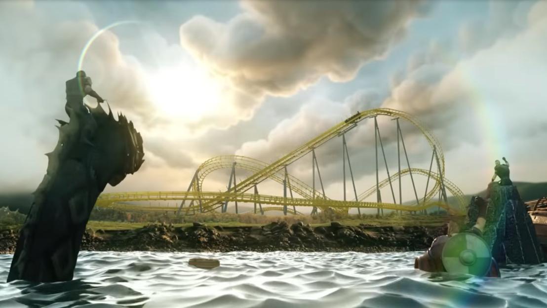 Illustration of a golden rollercoaster over water with two figures on rocks and a rainbow.