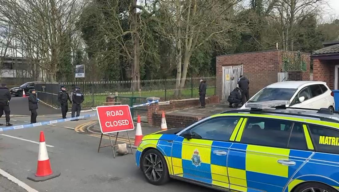 Police at Prescot Golf Club with a "Road Closed" sign and police tape.