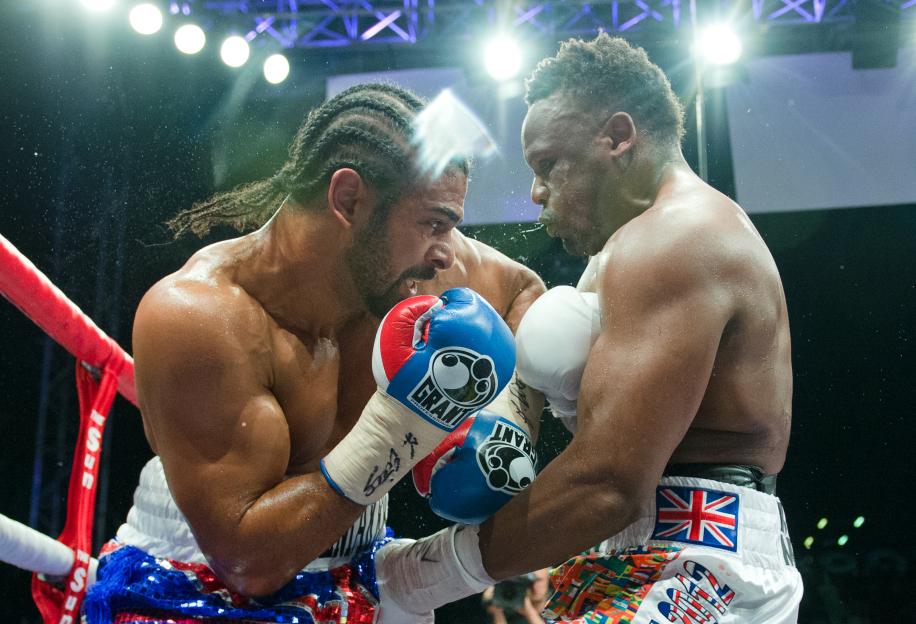 David Haye (L) throws a punch at Dereck