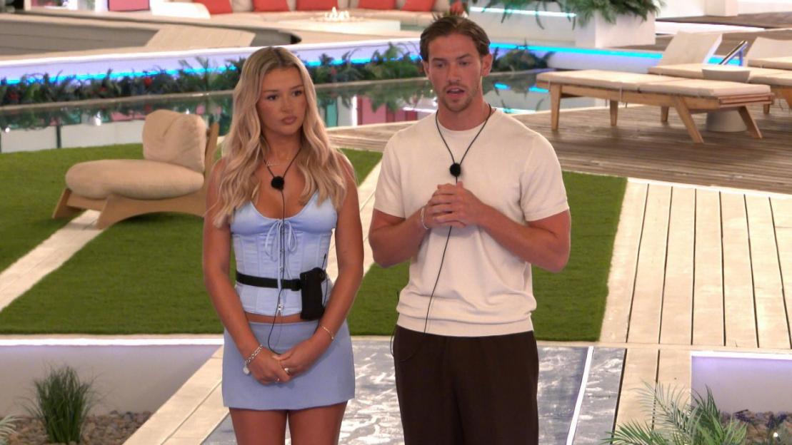 Two contestants from the TV show 'Love Island' stand outdoors.