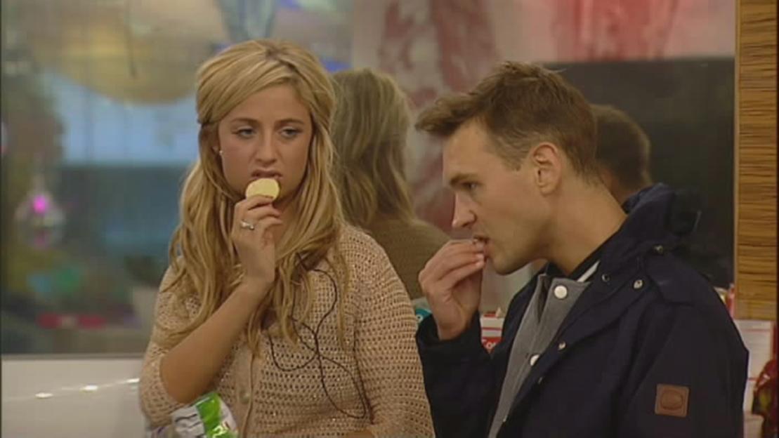 Chantelle Houghton and Samuel Preston from Celebrity Big Brother eating crisps.