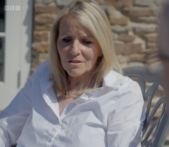 Sue Brydon in a white collared shirt.