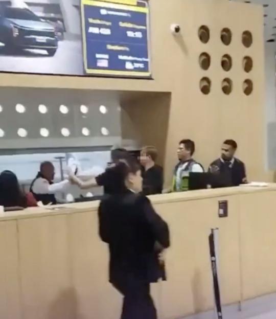 VIDEO: Passengers 'attack' airport staff in shocking brawl after being thrown off plane for alleged drunken rampage