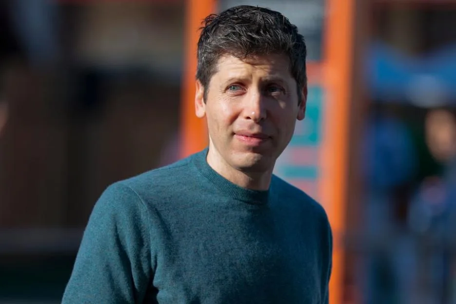 OpenAI CEO Sam Altman wearing a teal sweater.