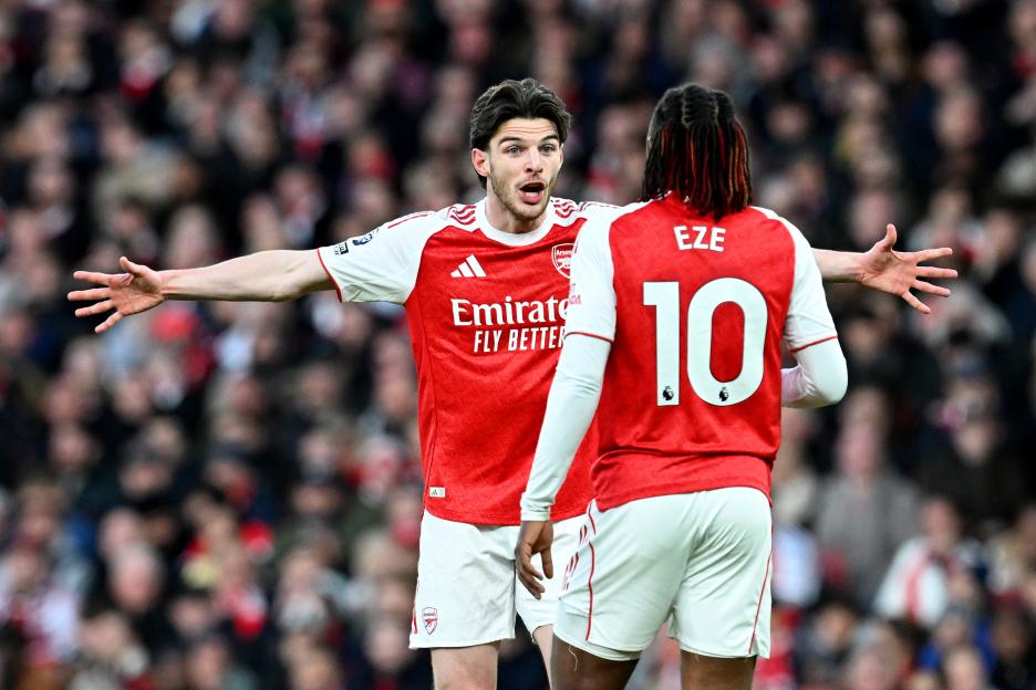 Declan Rice of Arsenal reacting towards teammate Eberechi Eze during a football match.