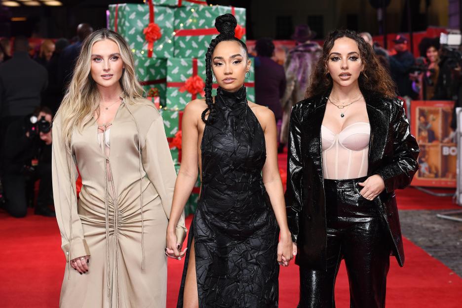 Three women from Little Mix, Perrie Edwards, Leigh-Anne Pinnock, and Jade Thirlwall, pose together at the "Boxing Day" world premiere.