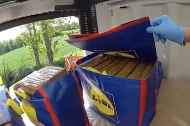 Moment fleeing drug dealer leaps from back of van after cops find £2m of cocaine stuffed inside Lidl bags as 2 jailed