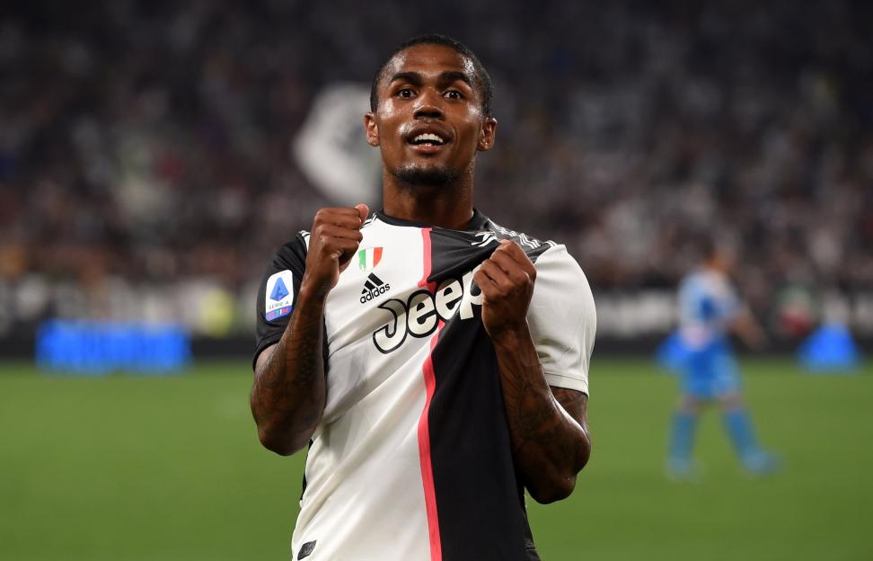 Douglas Costa celebrates a goal in his Juventus kit.