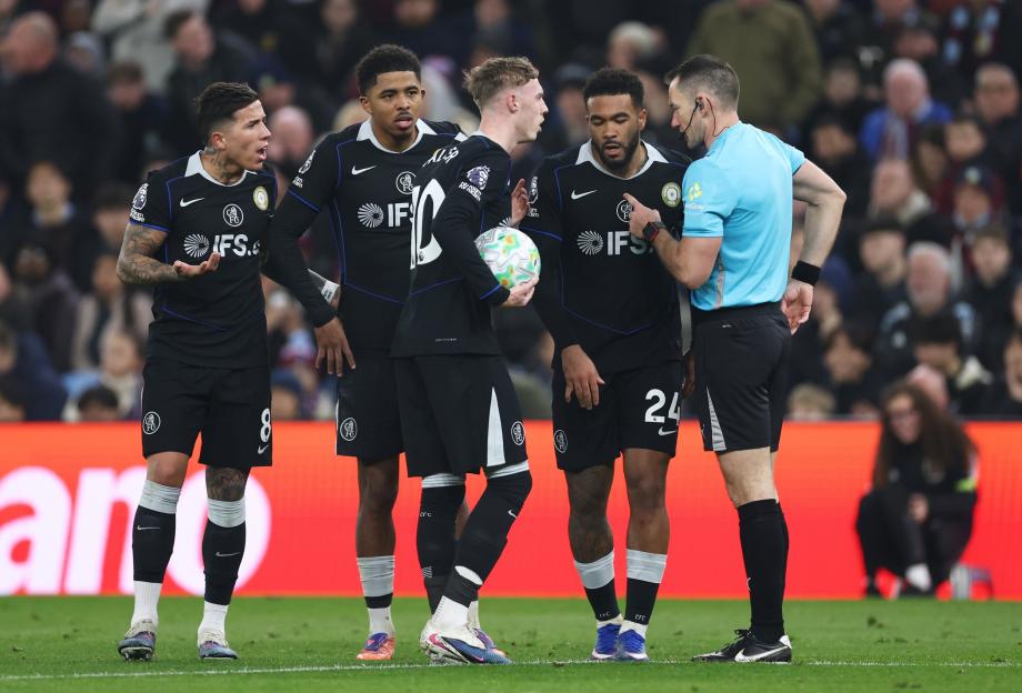 Chelsea players discuss a call with the referee during a Premier League match against Aston Villa.
