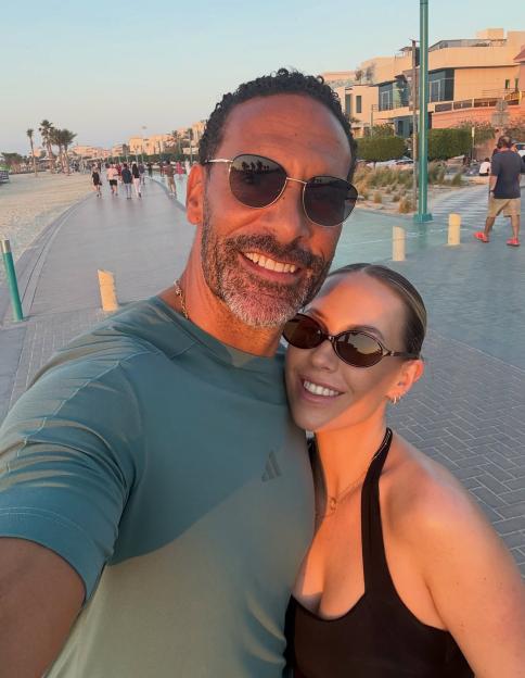 Kate and Rio Ferdinand smiling for a selfie on a boardwalk in Dubai.