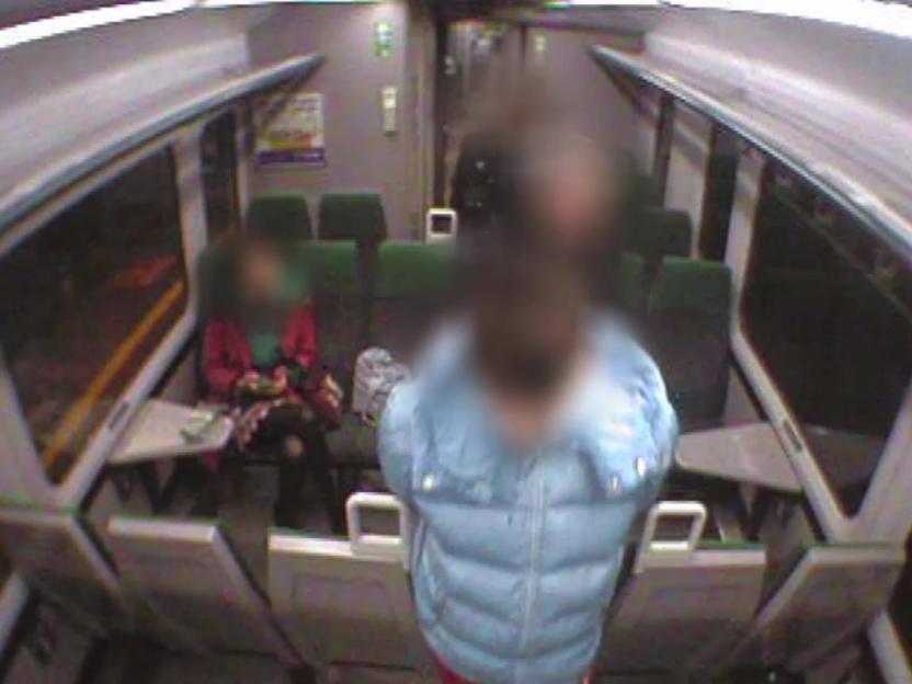 Video grab of a teen murder suspect on a train with other passengers.