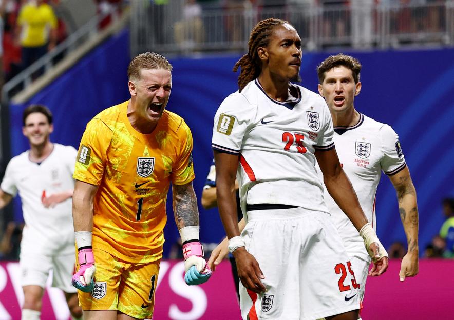 England's Djed Spence and teammates react after his tackle on Argentina's Giuliano Simeone.