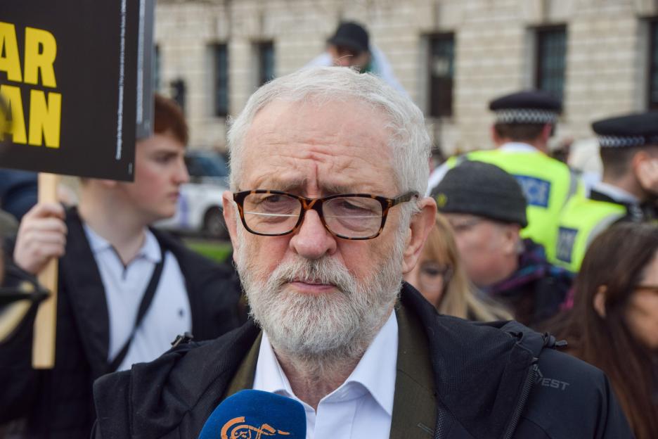 Jeremy Corbyn speaks to media at a protest.