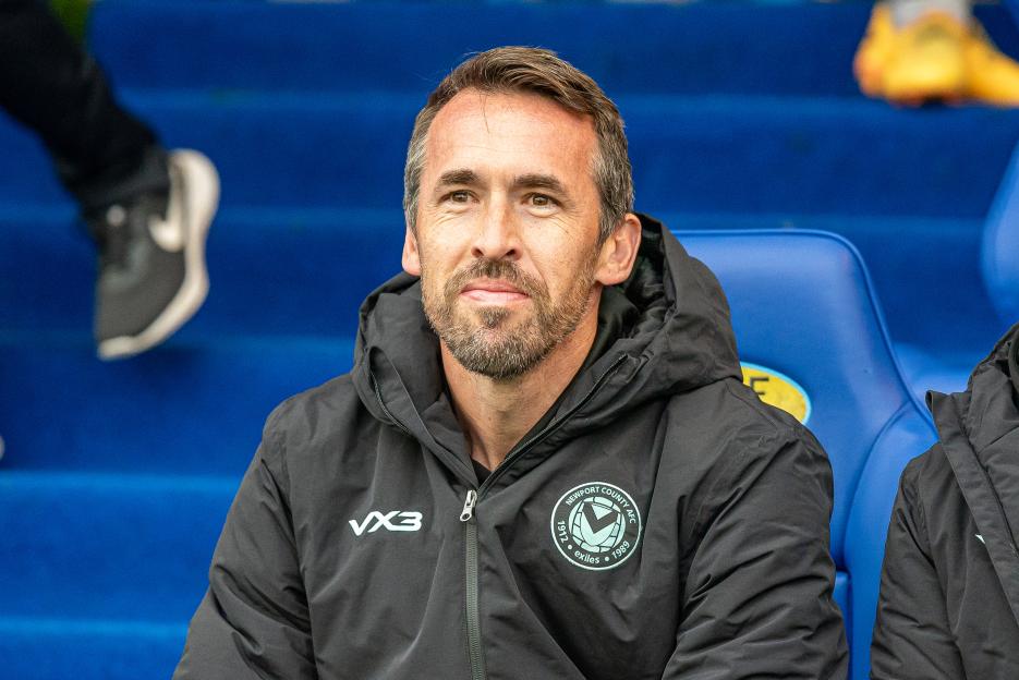Newport County Manager Christian Fuchs sitting on a bench.