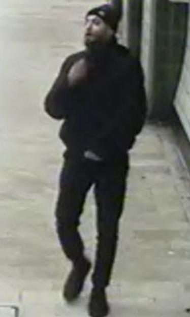Man in a black hoodie and beanie, wanted in connection with a sexual assault.