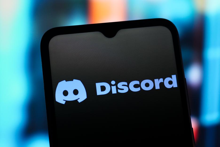 In this photo illustration, the Discord logo is seen...