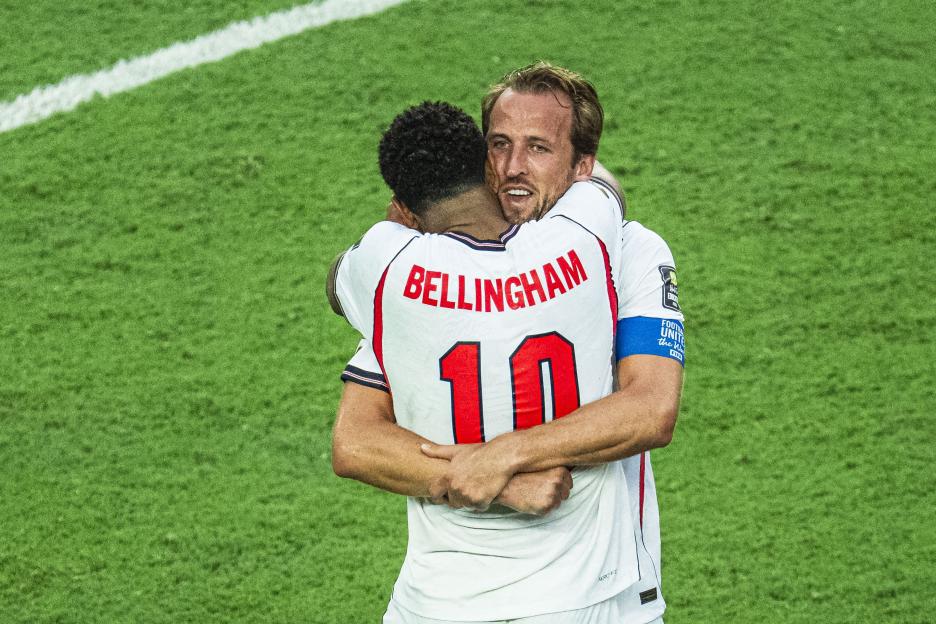 Harry Kane embraces Jude Bellingham after England's win against Norway in the FIFA World Cup Quarter-Final.