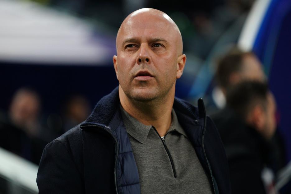 A man with a bald head and a stubble beard looks forward from the stands during the Marseille v Liverpool UEFA Champions League match.