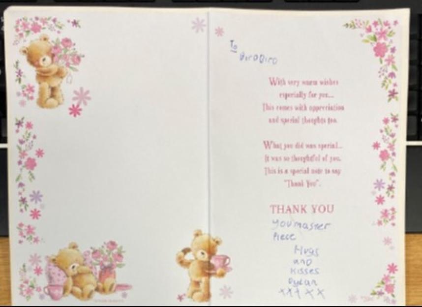 Open thank you card with teddy bears and pink flowers.