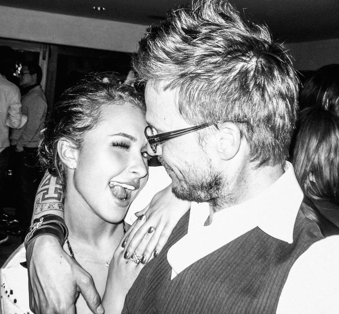 Hayden Panettiere with a man in glasses in a black and white photo.