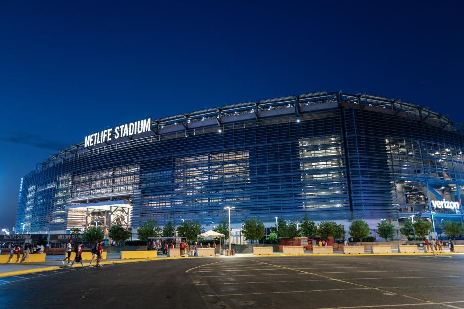 MetLife Stadium illuminated at night.