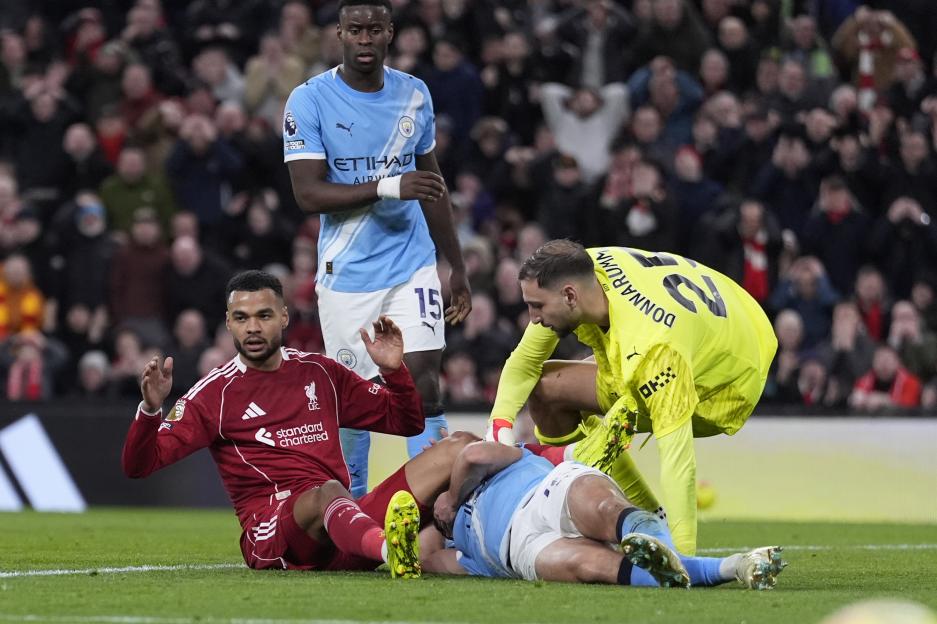 Manchester City's Abdukodir Khusanov injured from a collision with Manchester City goalkeeper Gianluigi Donnarumma.